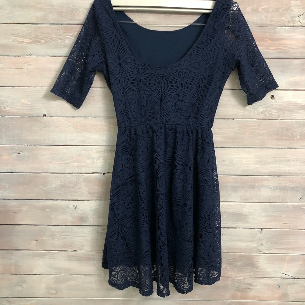 Navy blue dress with lace pattern overlay